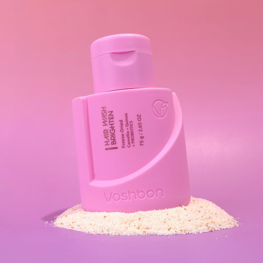 Voshbon Brighten Hair Wash on Granules with a gradient pink background.