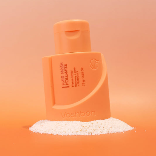 Voshbon Volumize Hair Wash on Granules with a gradient orange background.