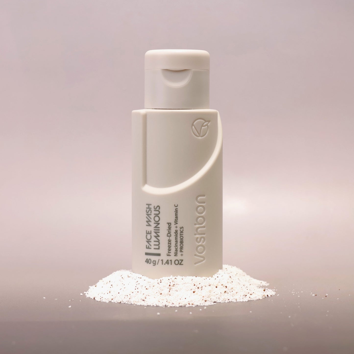 Voshbon Luminous Face Wash on Granules with a gradient gray background.