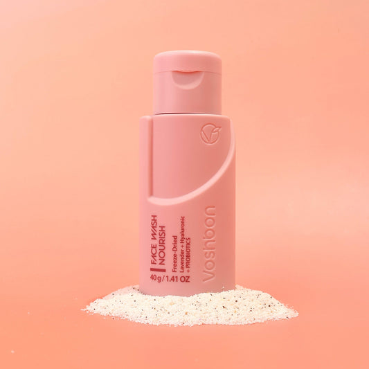 Voshbon Nourish Face Wash on Granules with a gradient pink background.