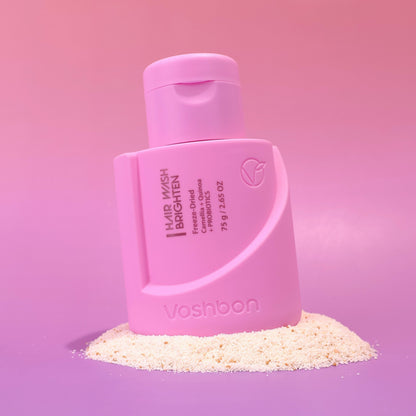 Voshbon Brighten Hair Wash on Granules with a gradient pink background.