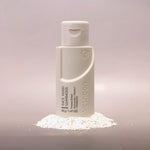 Voshbon Luminous Face Wash on Granules with a gradient gray background.
