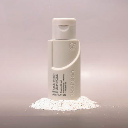 Voshbon Luminous Face Wash on Granules with a gradient gray background.
