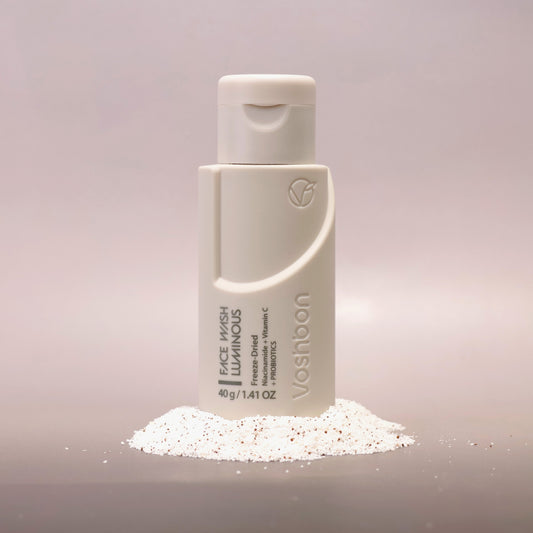 Voshbon Luminous Face Wash on Granules with a gradient gray background.
